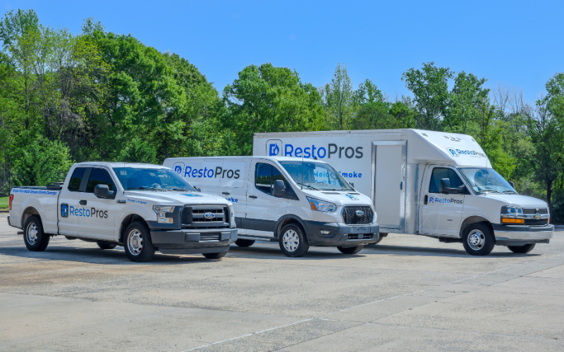 RestoPros of Central Maryland team and restoration vehicles
